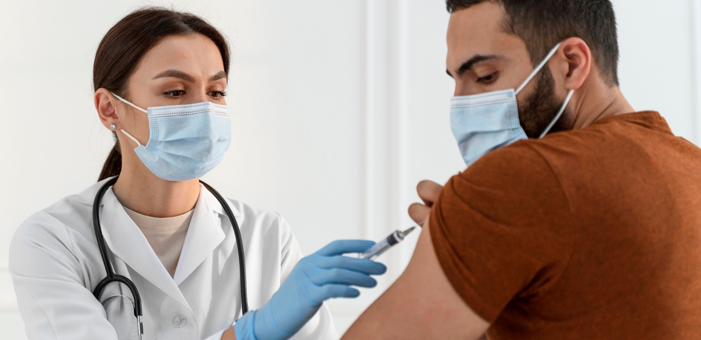 a nurse giving a corona vaccination